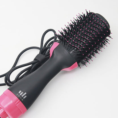Black and pink hair styling tool on a white background