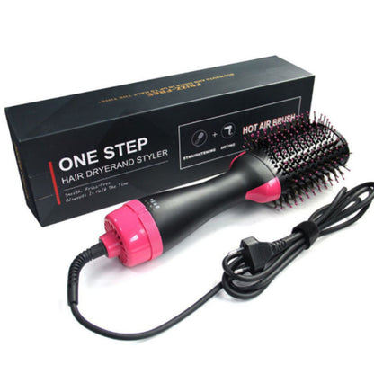 One Step Hair Dryer and Styler with pink nozzle and black bristle brush attachment, next to its packaging.